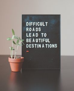 Image of a sign that reads difficult roads lead to beautiful destinations. Find the coping skills you need after a major life change with life transitions therapy in Austin, TX.