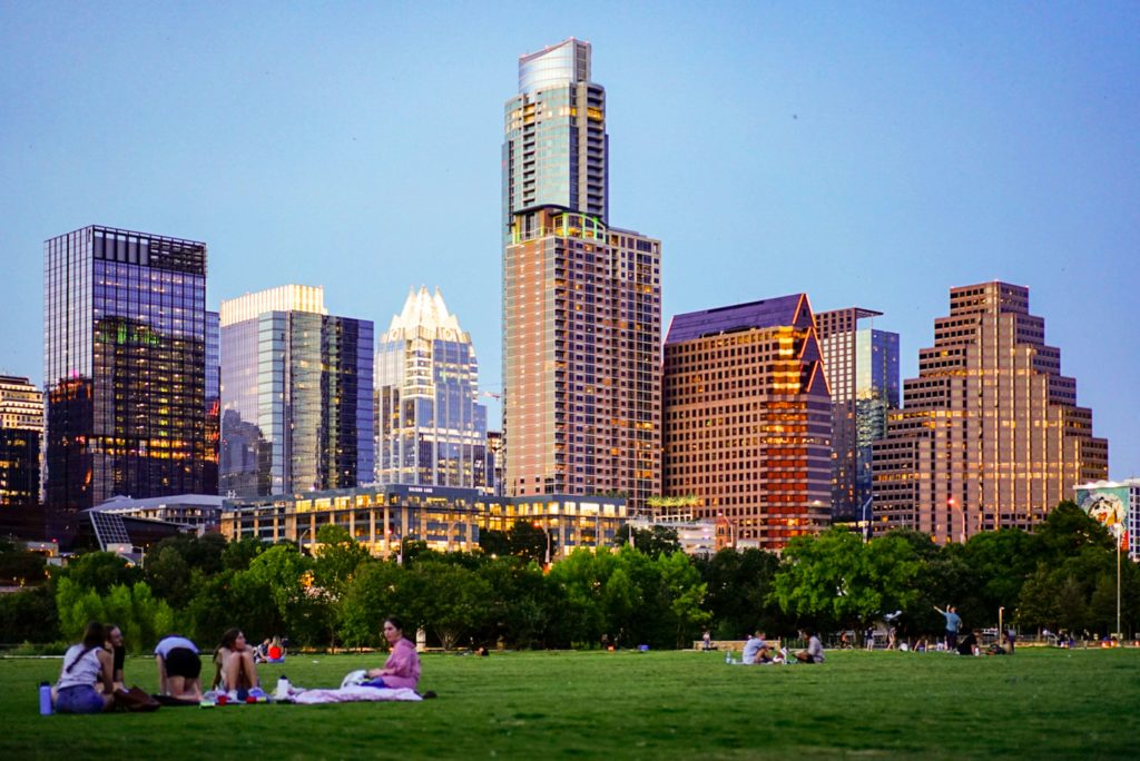 Image of the Austin, TX skyline from Zilker Park. Work with a skilled life transition therapist in Austin, TX to help you cope with major life transitions.